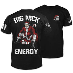 A black t-shirt with an image on the back of Santa Claus sitting on a bag of presents with the words "Big Nick Energy", and a small pocket image on the front of a Santa hat.