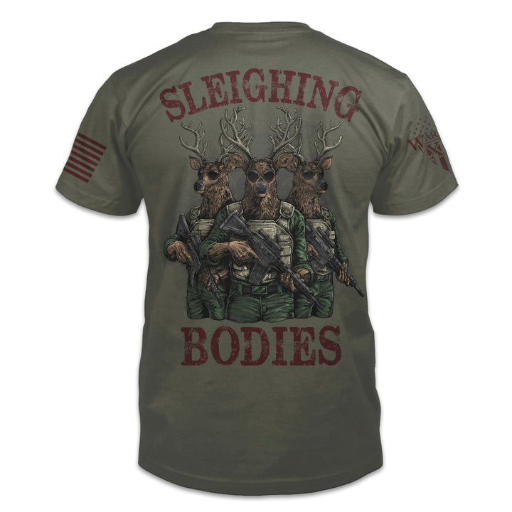 The reindeer games are over on Warrior 12's military green "Sleighing Bodies" t-shirt, this picture shows the back design only. The back shows 3 reindeers holding AR-15's ready for battle, with the red text Sleighing Bodies.