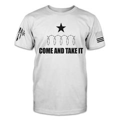 A white t-shirt with the words "Come and take it" below razor wire and a star.