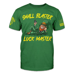 "Small Blaster, Luck Master" is printed on a green t-shirt with the main design printed on the the front and the back of this t-shirt has no printing. This shirt features our brand logo on the right sleeve and the American Flag on the left sleeve.