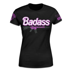 A black women's relaxed fit t-shirt with the word "Badass" in white and hot pink with a black and how pink rifle underneath. 