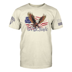 "We The People" is printed on a natural color t-shirt with the main design printed on the front and the back of this t-shirt has no printing. This shirt features our brand logo on the right sleeve and the American Flag on the left sleeve.