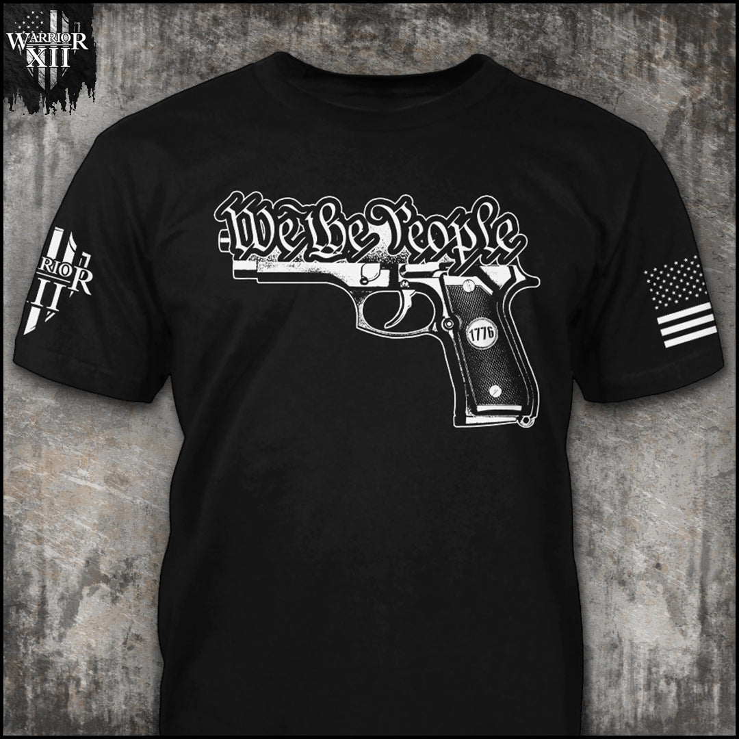 Front black shirt with the main design, "We The People" written above a gun