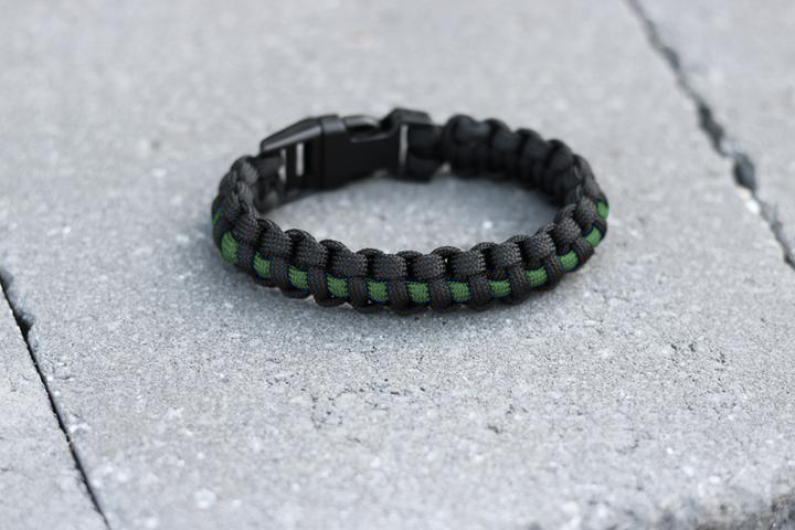 A survival Thin Green Line Paracord bracelets enable you to carry several feet of Paracord that can be used in countless emergency situations.