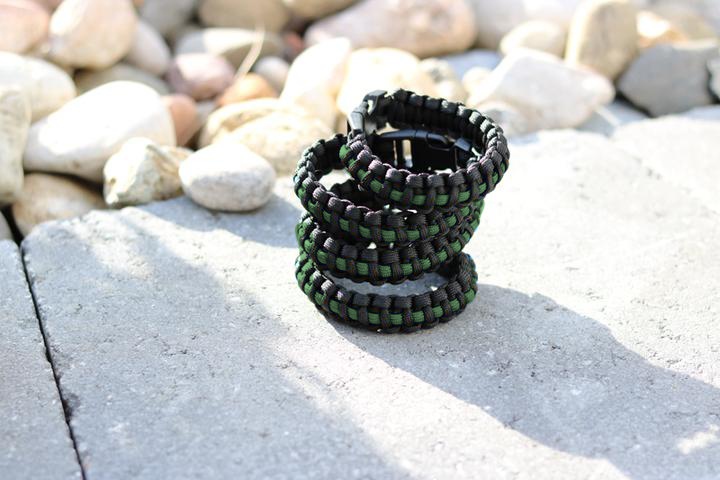 Stacked survival Thin Green Line Paracord bracelets enable you to carry several feet of Paracord that can be used in countless emergency situations.