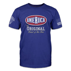 A blue t-shirt with "America - The Original Land Of The Free" printed on the front of the shirt.