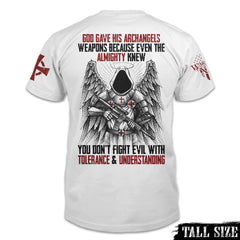 A white tall sized shirt with the words "God gave his archangels weapons, because even the Almighty knew you don't fight evil with tolerance and understanding" with an Archangel holding a gun printed on the back of the shirt.