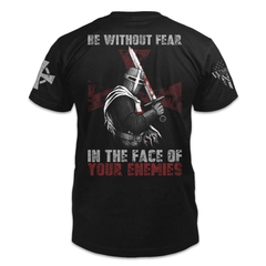 A black t-shirt with the words "Be without feat In the face of your enemies" with a knights templar holding a sword printed on the back of the shirt.