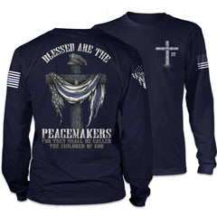 Front & back navy blue Blessed Are The Peacemakers long sleeve shirt with the cross, a police hat, and the back the blue flag printed on the shirt.