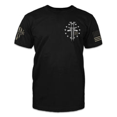 A black t-shirt with two guns and stars printed on the front of the shirt.