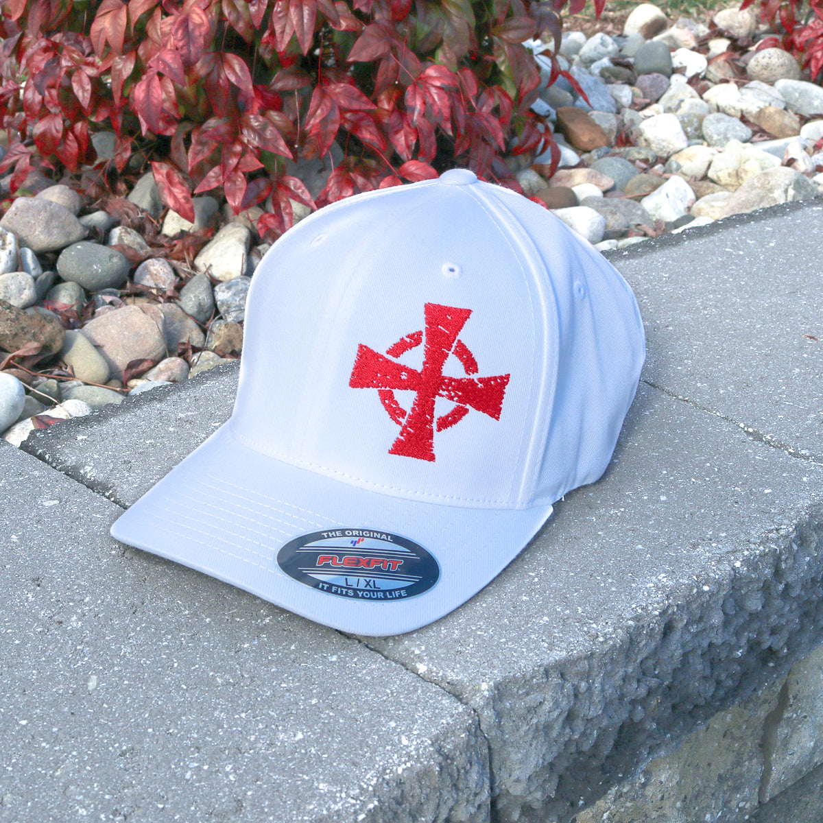 A Crusader Flexfit hat features the Warrior 12 crusader cross embroidered on white a Flexfit hat.