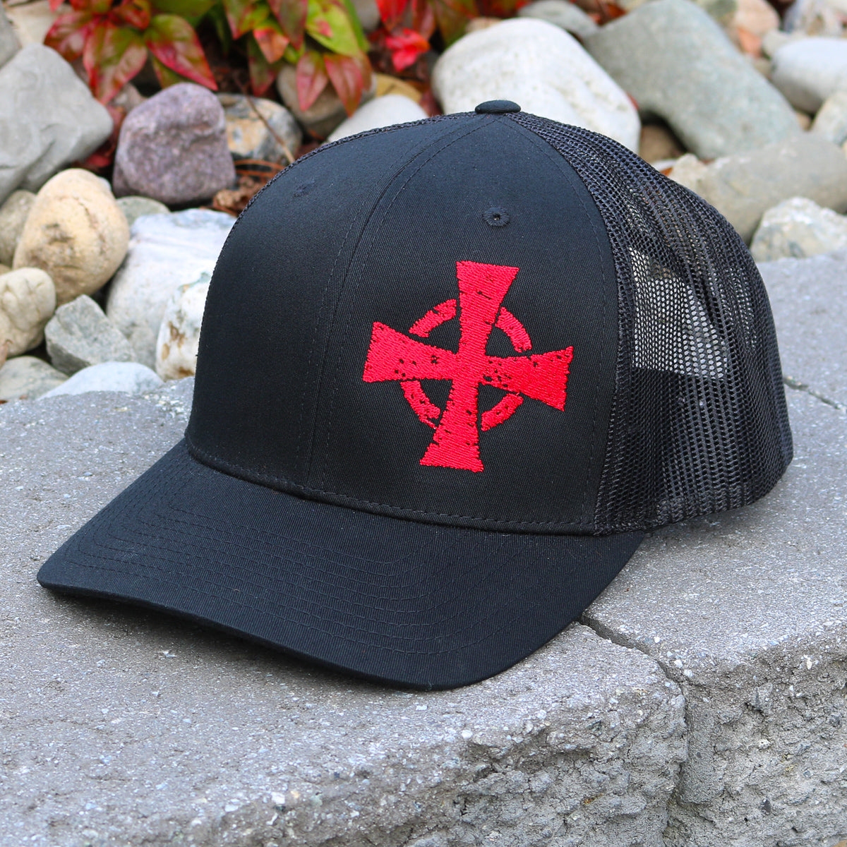 A Crusader hat features the Warrior 12 crusader cross embroidered on black a Richardson mesh snapback hat.