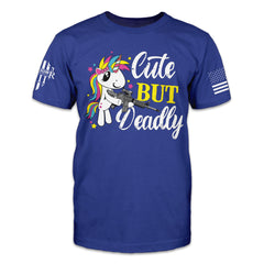 Blue t-shirt with the words "cute but deadly" and a unicorn holding a gun printed on the front of the shirt.