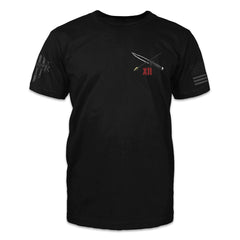 A black t-shirt with a dagger and arrow crossed printed on the front of the shirt.