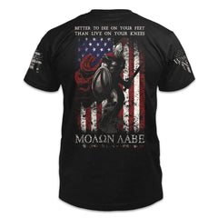 A black t-shirt with the words "Better To Die On Your Feet Than Live On Your Knees, "MOLON LABE" with a spartan in front of the USA flag printed on the shirt.