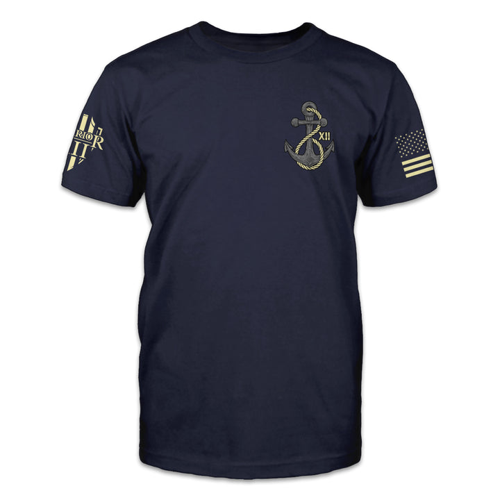 A navy blue t-shirt with an anchor printed on the front of the shirt.