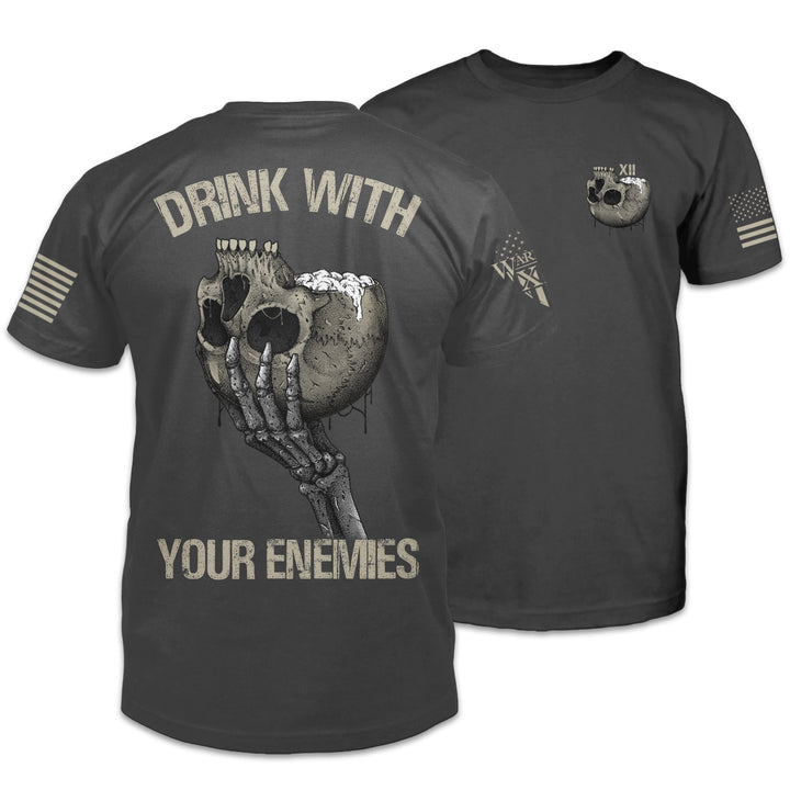 An asphalt grey t-shirt featuring a an upside-down skull with a foamy beverage coming out of the skull on the front and back. The back has the words "Drink with your enemies."