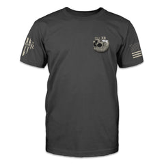 An asphalt grey t-shirt featuring a an upside-down skull with a foamy beverage coming out of the skull on the front pocket area.
