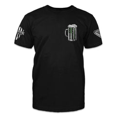 A black t-shirt with a beer mug with a green USA flag in it printed on the front.