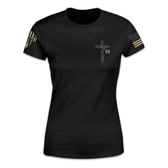 A black women's relaxed fit shirt with a cross and roman numerals XII printed on the front of the shirt.