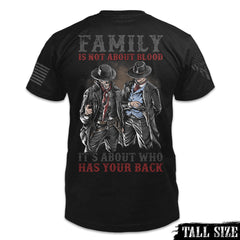 A black tall size shirt with the words "Family is not about blood, it's about who has your back" with a two western cowboys printed on the back of the shirt.