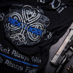A close up of a  black t-shirt paying tribute to history and traditions of Irish American Law Enforcement and showing true Celtic Pride. Fir Na Dli, meaning, men of law‚ in Gaelic, is written across the back.