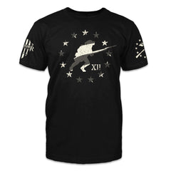 A black t-shirt with a soldier running with stars around him in a circle printed on the front of the shirt.