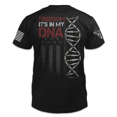 A black t-shirt with the words "Freedom In My DNA" with a DNA strand and USA Flag printed on the back of the shirt.