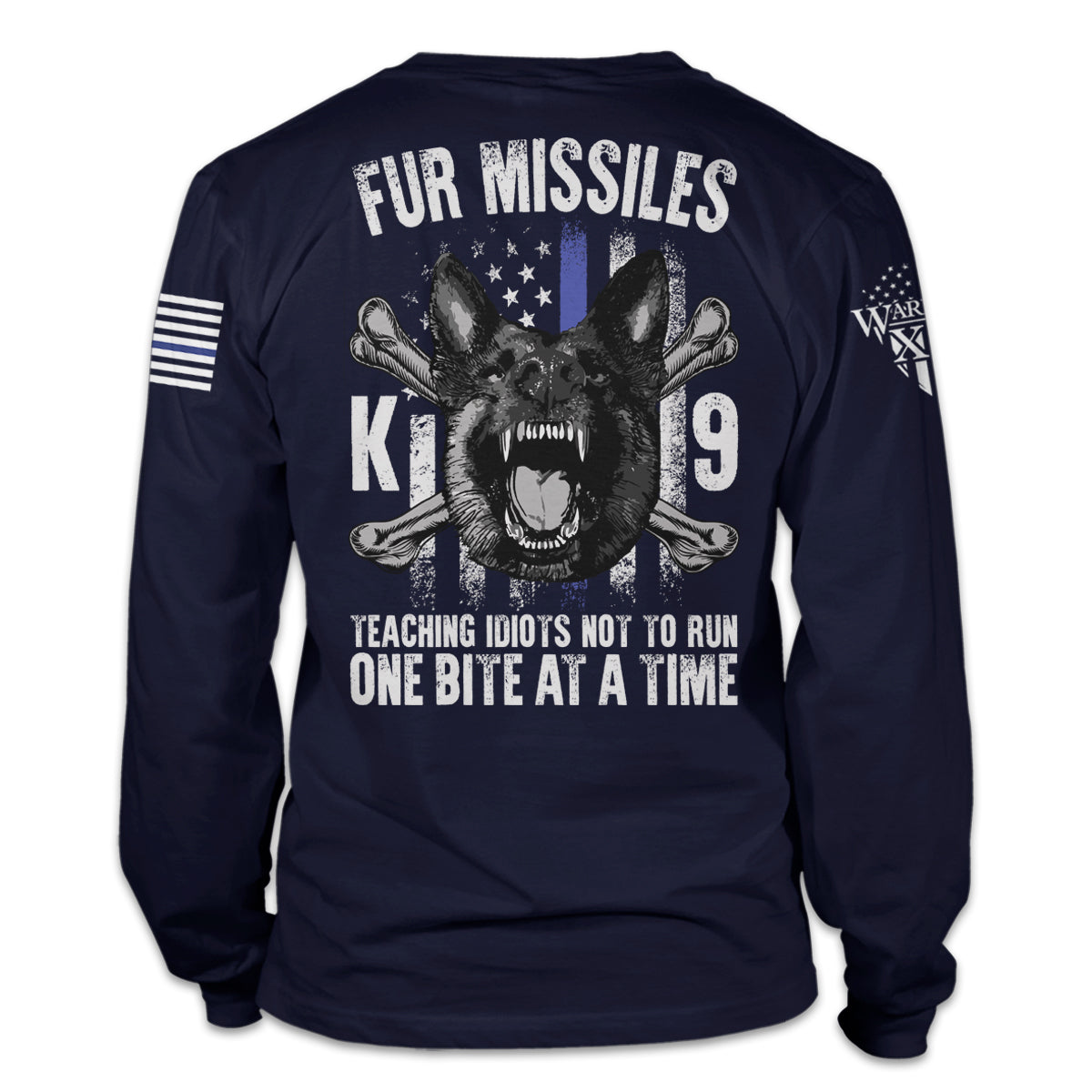 A navy blue long sleeve shirt with the words "Fur Missiles, Teaching Idiots Not To Run, One Bite At A Time!" featuring a german shepherd showing teeth in front of a thin blue line USA flag printed on the back of the shirt.