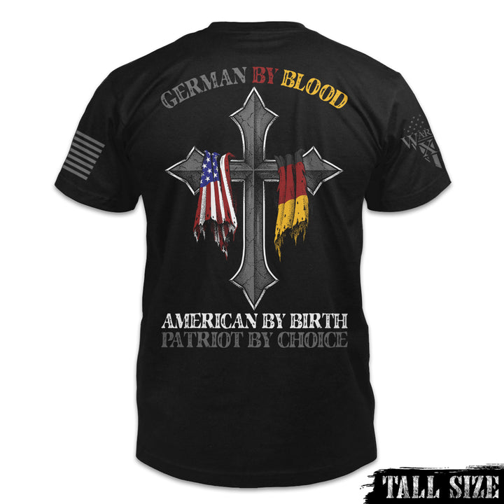 A black tall size shirt with the words 'German by blood, American by birth, patriot by choice" and a cross with the German and USA flag hanging over it printed on the back of the shirt.