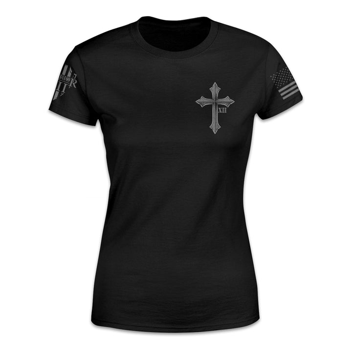 A black women's relaxed fit'shirt with a cross and roman numerals XII printed on the front of the shirt.