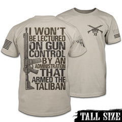 Front & back light tan tall size shirt with the words 'I won't be lectured on gun control by an administration that armed the Taliban" with an AR15 printed on the shirt.
