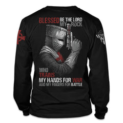 A black t-shirt with the words "Blessed be the lord, my rock, who trains my hands for war and my fingers for battle" with a crusader holding a gun printed on the back of the shirt.