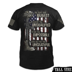 Back of  black tall sized  t-shirt with the words "We sent our bravest, Led by the unqualified, To do the impossible, And die for the ungrateful" with a USA flag, soldiers boot, helmet and gun printed on the shirt.