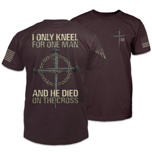 Front & back burgundy t-shirt with the words "I only kneel for one man, and he died on the cross" with a cross printed on the shirt.