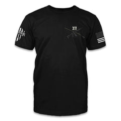 A black t-shirt with two guns crossed over with the roman numerals XII printed on the front.