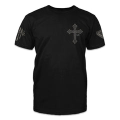 A black t-shirt with an Irish cross printed on the front of the shirt.