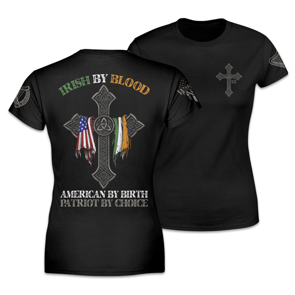 Front & back black women's relaxed fit'shirt with the words "Irish by blood, American by birth, patriot by choice" with a cross holding an American and Irish flag printed on the shirt.