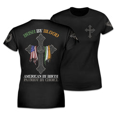 Front & back black women's relaxed fit'shirt with the words "Irish by blood, American by birth, patriot by choice" with a cross holding an American and Irish flag printed on the shirt.