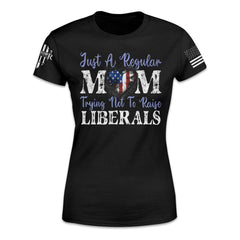 A women's relaxed fit shirt with the words "Just a regular mom trying not to raise liberals" printed on the front.