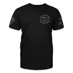 A black t-shirt with stars and two bayonets crossed over printed on the front of the shirt.