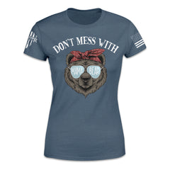 A slate blue women's t-shirt with an image of a bear wearing sunglasses and the words "Don't mess with Mama Bear"