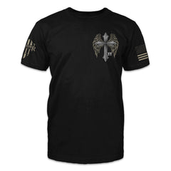 A black t-shirt with a cross with wings printed on the front.