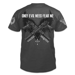 A dark grey t-shirt with the words "Only evil need fear me" which is an an old Irish saying; a warning against those who would prey on others with two guns printed on the back of the shirt.