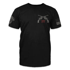 A black t-shirt with two pistols crossed over with the words "XII" printed on the front.