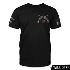 A black tall size shirt with two pistols crossed over with the words "XII" printed on the front.