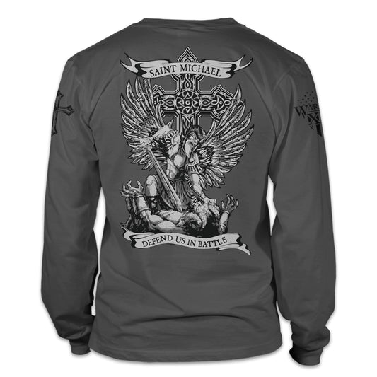 A grey long sleeve shirt with the words "Saint Michael defend us in battle" with Saint Michael Archangel in battle printed on the back of the shirt.