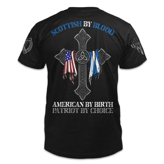 A black t-shirt with the words "Scottish by blood, American by birth, patriot by choice" with a cross holding the American and Scottish flag printed on the back of the  shirt.