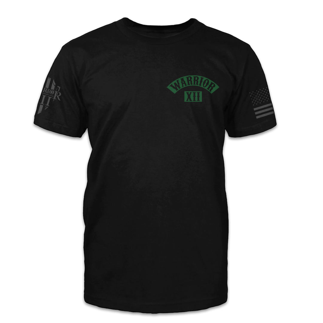 A black t-shirt with the words Warrior XII printed on the front of the shirt.