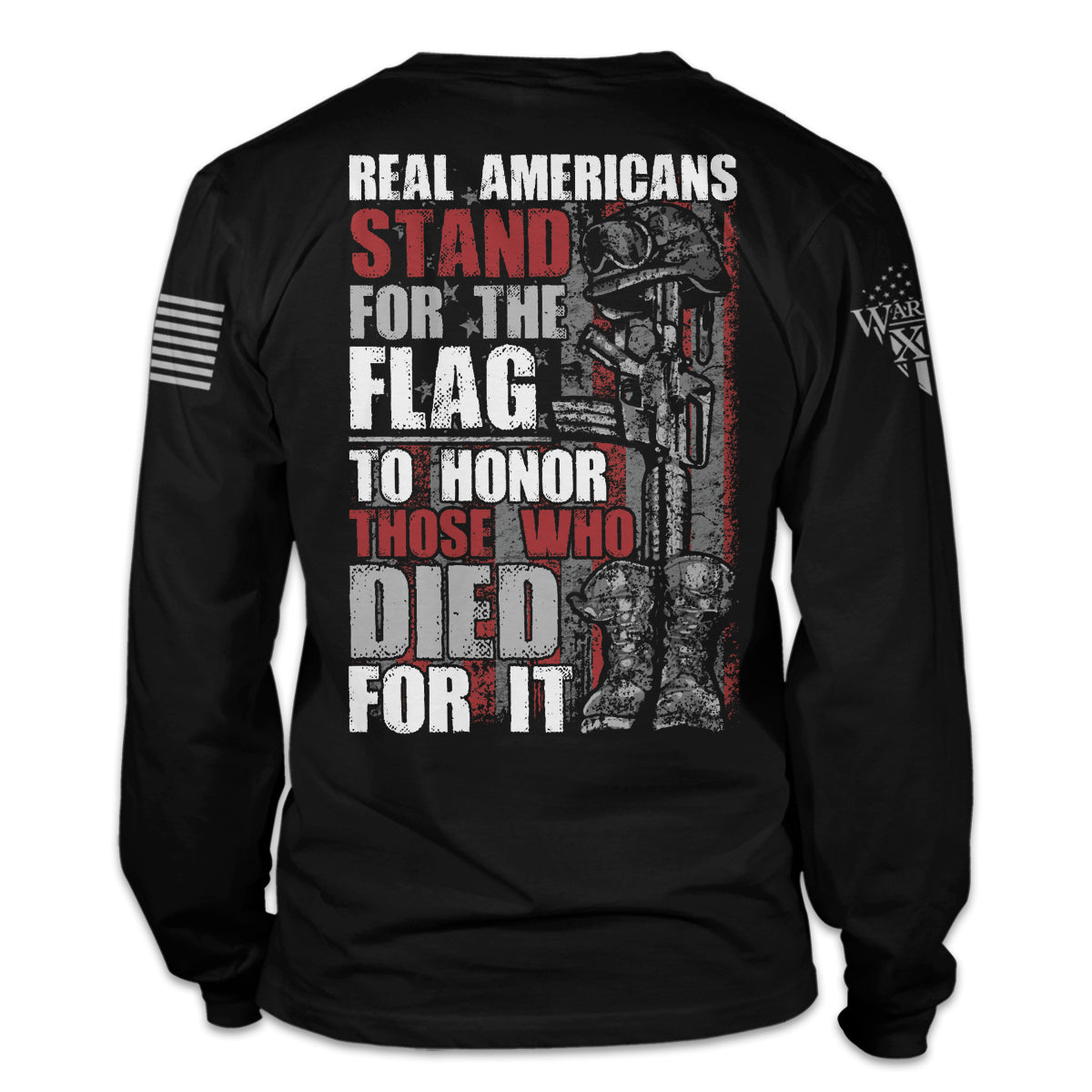 A black long sleeve shirt with the words "Real Americans Stand For The Flag To Honor Those Who Died For It!" printed on the back of the shirt.